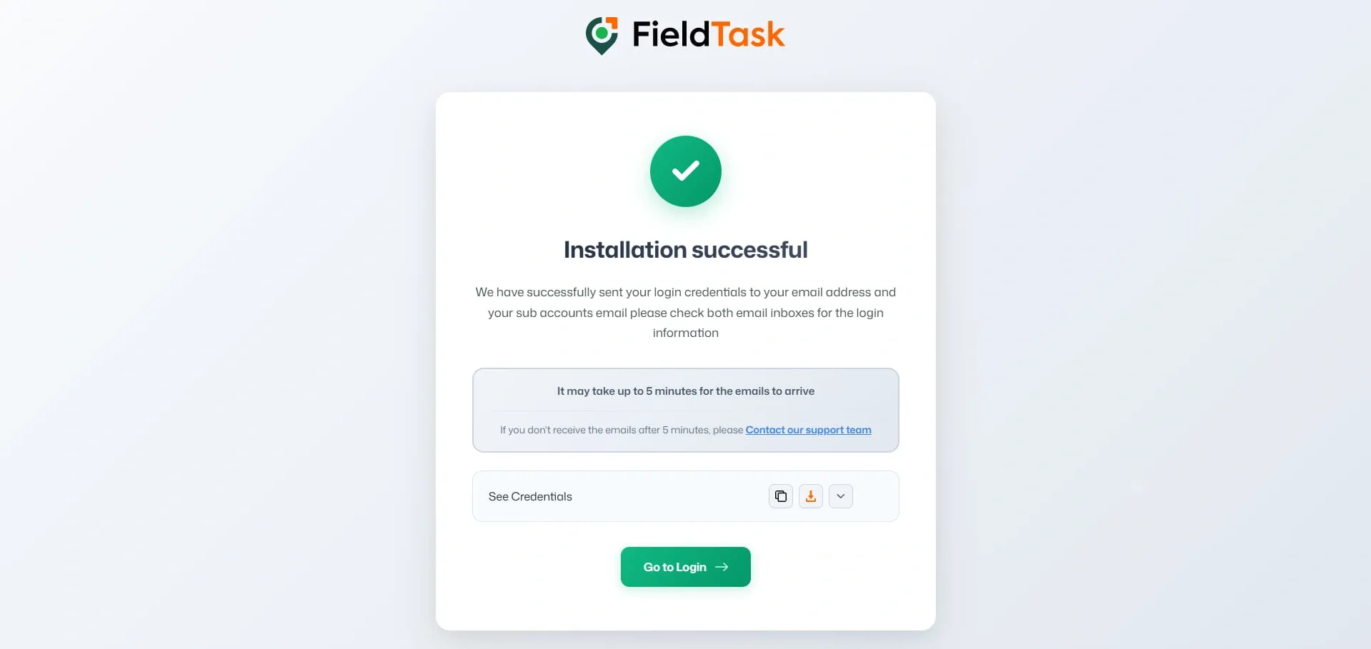 FieldTask installation successful page showing a green checkmark, login credentials sent notice, five-minute email reminder, See Credentials panel with copy/download controls, support link, and green Go to Login button on a light background.